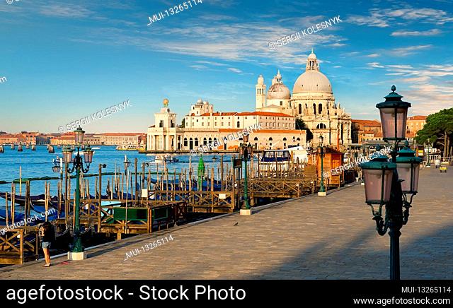 Venice with gondolas on Grand Canal against San Giorgio Maggiore church in Venice, Italy