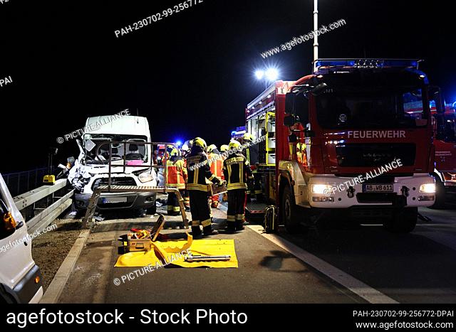 02 July 2023, Bavaria, Bischbrunn: Firefighters are on duty at the scene of an accident on the A3 autobahn. Two people were injured in a rear-end collision on...