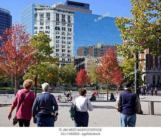 Grand Rapids, Michigan - People walk in Rosa Parks Circle on a warm autumn day  The plaza was designed by Maya Lin, it is used for concerts and dances in summer...