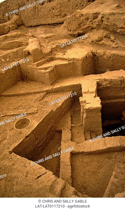 Desert city and archaeological site. Built structure. Excavations. Buildings. Steps. Into earth. Sumarian Amorite. Euphrates river bank. 2, 000 BC