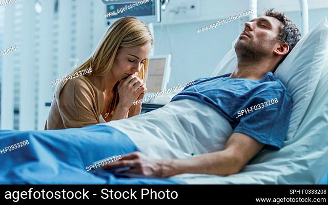 Wife visiting her recovering husband in the hospital