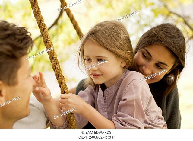 Close up of family on swing