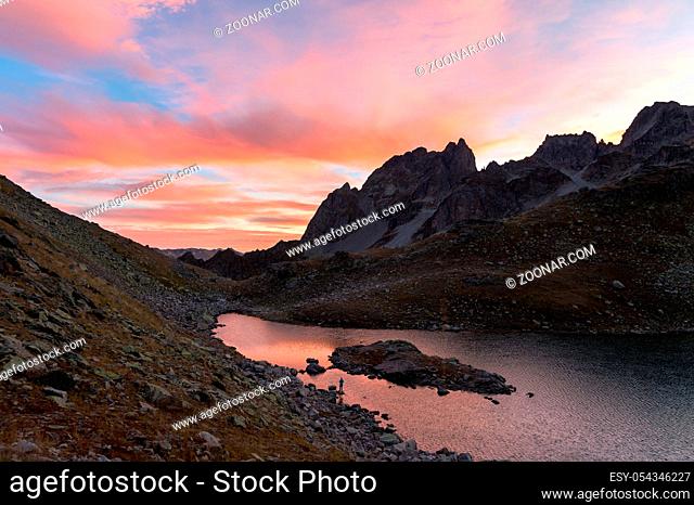 Sunset in arkhyz in the northern Caucasus over the lake top Zapyataya. Sunset twilight in the mountains