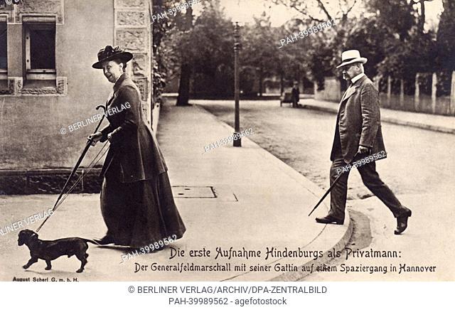 A contemporary postcard depicts the former Field Marshal and Chief of the General Staff Paul von Hindenburg and his wife Gertrud von Hindenburg as they walk...