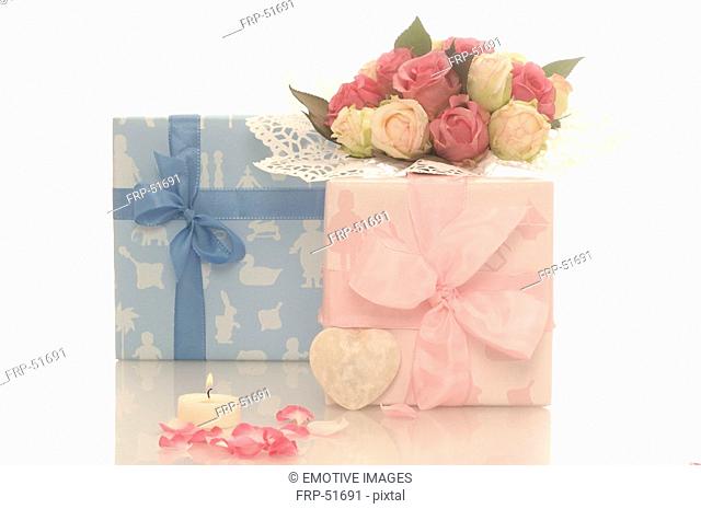 Blue and pink gift and a bouquet