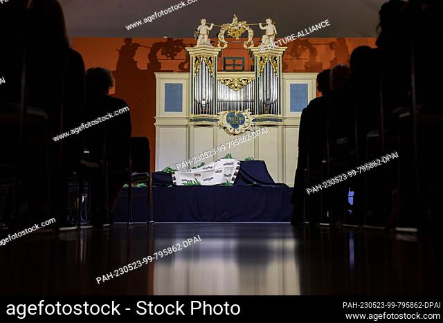 23 May 2023, Saxony, Leipzig: Cloth-covered boxes containing Maori and Moriori human remains stand in front of an organ during a return ceremony