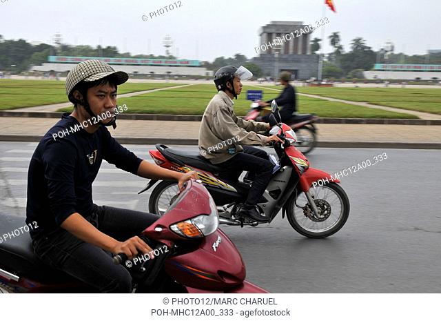 Motorcyclists drive past the mausoleum of the former president Ho Chi Minh November 11, 2009