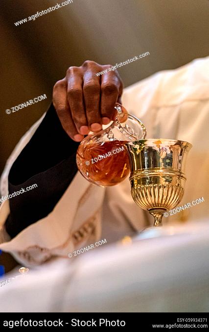The elevation of the Goblet with the sacramental wine during the Catholic Liturgy of the Eucharist