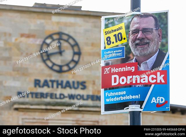 04 October 2023, Saxony-Anhalt, Bitterfeld-Wolfen: An election poster of AfD candidate Dornack hangs outside the town hall