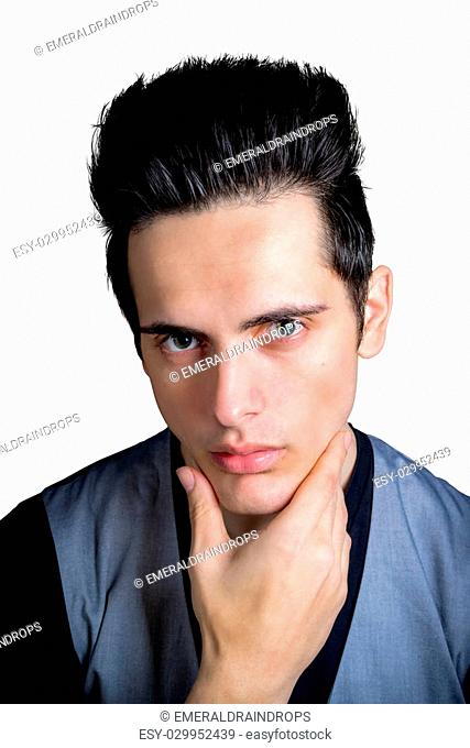 Cute Dark Hair Green Eye Male With Hand On Chin