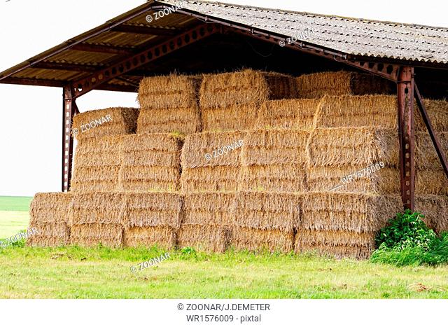 straw bales under the roof