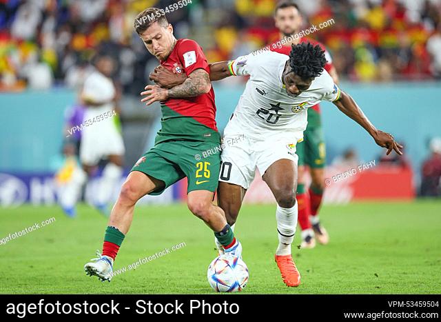 Portuguese Otavio and Ghana's Mohammed Kudus fight for the ball during a soccer game between Portugal and Ghana, in Group H of the FIFA 2022 World Cup in Doha