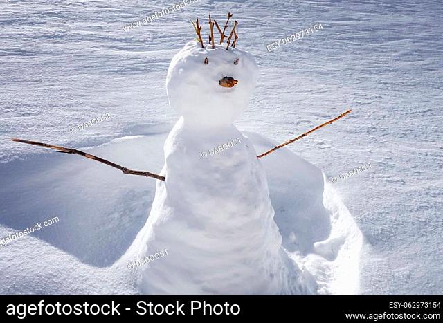 Snowman in the snow during winter. Sunny day