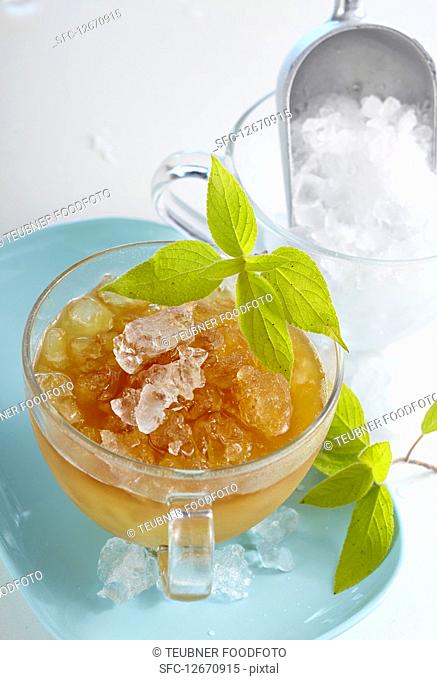 Pineapple iced tea with pineapple sage, black tea and crushed ice