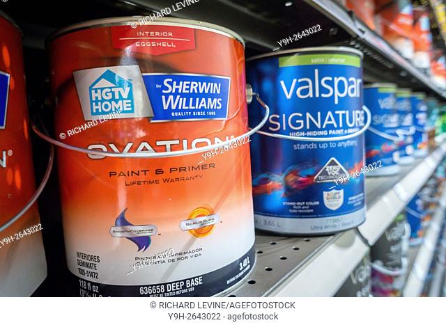 Cans of Valspar and HGTV by Sherwin-Williams brand paint are seen in a hardware store in New York