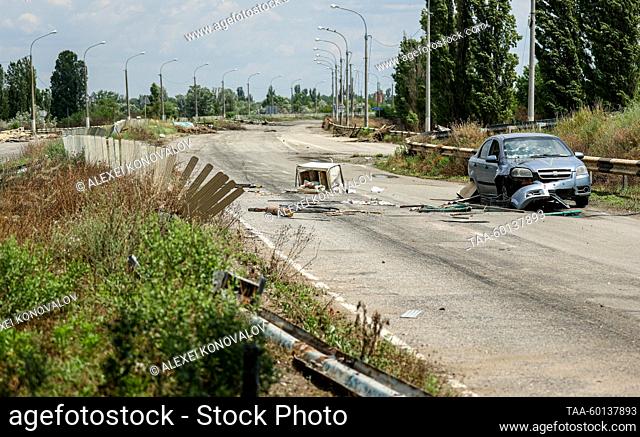 RUSSIA, KHERSON REGION - JUNE 27, 2023: A damaged vehicle is pictured at a road junction near the village of Alyoshki on the route to the Antonovka Road Bridge