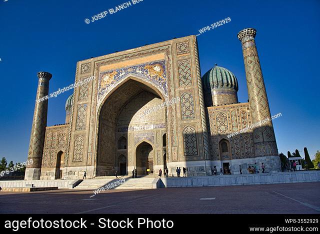 Registan place, Uzbekistan, Silk Road, Samarkand, listed as World Heritage by UNESCO, walking people in front of the Sher-dor Madrasah