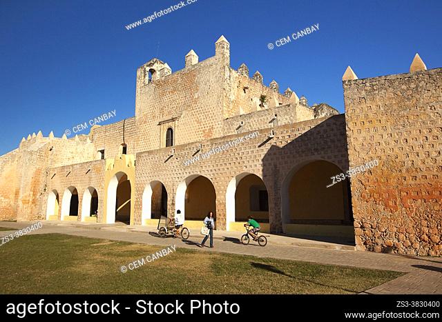 Cyclists in front of Templo De San Bernardino y Convento De Sisal at the historic center, Valladolid, Yucatan Province, Mexico, Central America