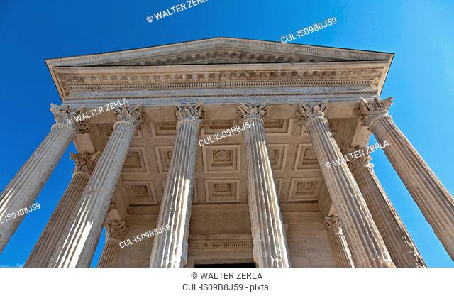 Low angle view of Maison Carree facade, Nimes, Languedoc-Roussillon, France