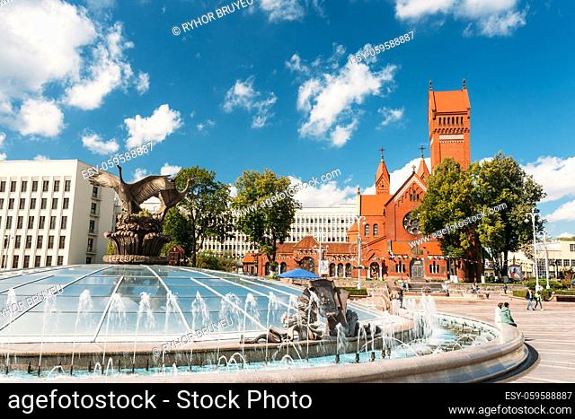 Church Of Saints Simon And Helen (Red Church) And Fountain At Independence Square In Minsk, Belarus