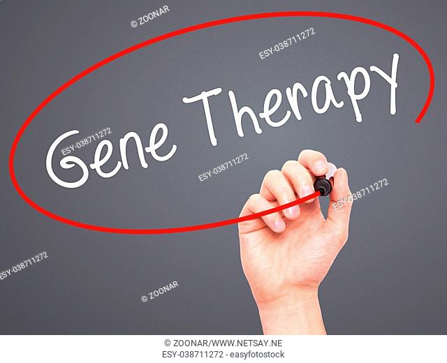 Man Hand writing Gene Therapy with black marker on visual screen