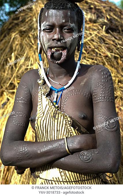 Teenage girl belonging to the Mursi tribe ( Omo valley, Ethiopia)