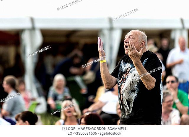 An elderly festivalgoer dancing at the Brentwood Festival