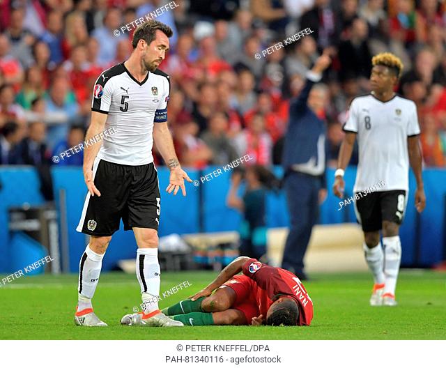 Nani of Portugal lays on the floor after being fouled by Christian Fuchs of Austria during the UEFA Euro 2016 Group F soccer match Portugal vs