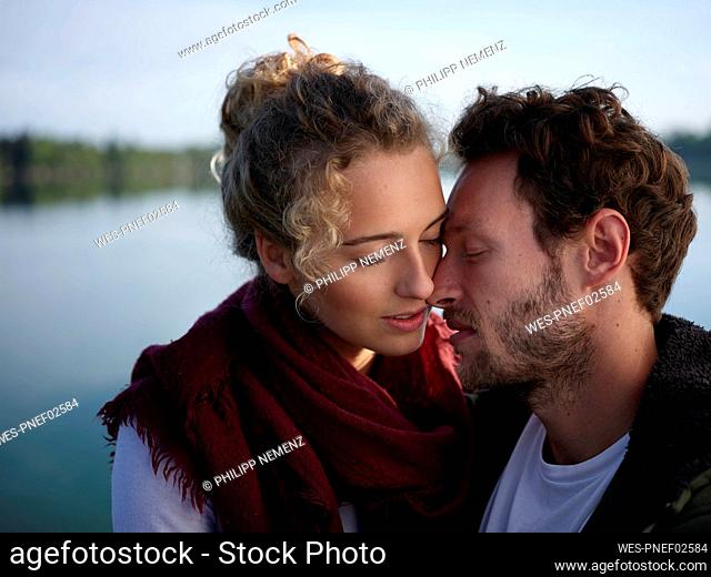 Romantioc couple kissing at lake