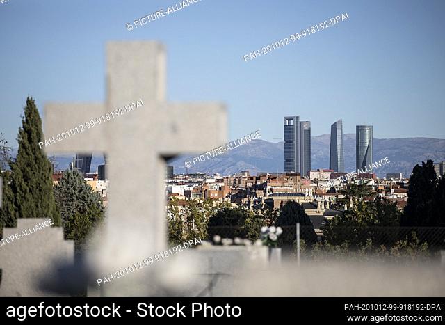 12 October 2020, Spain, Madrid: View from Almudena cemetery to the..Cuatro Torres Business Area, a complex of skyscrapers and a symbol of Madrid's economic life