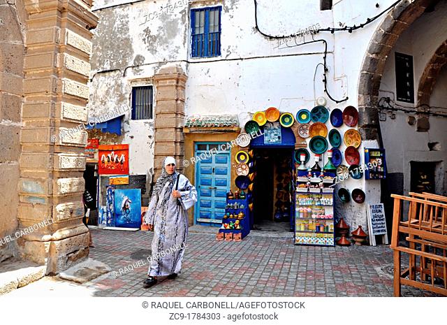 Woman walking the streets of the medina, Essaouira, Morocco