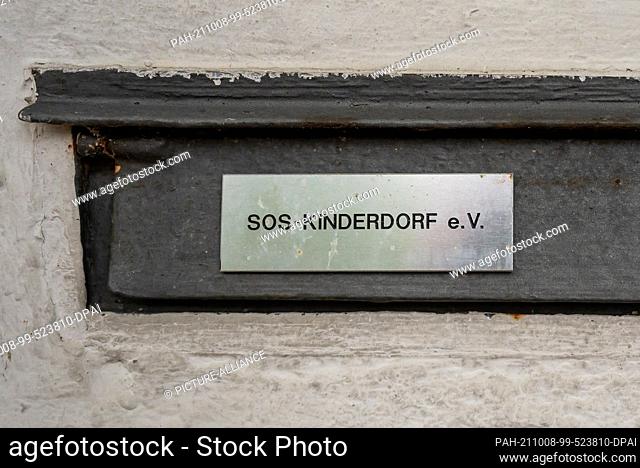 08 October 2021, Bavaria, Munich: The lettering ""SOS-Kinderdorf e.V."" can be read on a sign on the mailbox. (to dpa ""Serious suspicion: ""Border violations""...