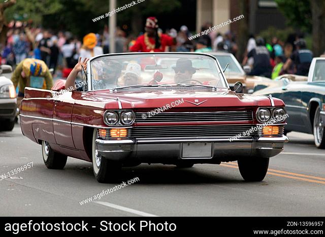Louisville, Kentucky, USA - May 03, 2018: The Pegasus Parade, a Cadillac Caddy classic car, going down W Broadway during the Parade