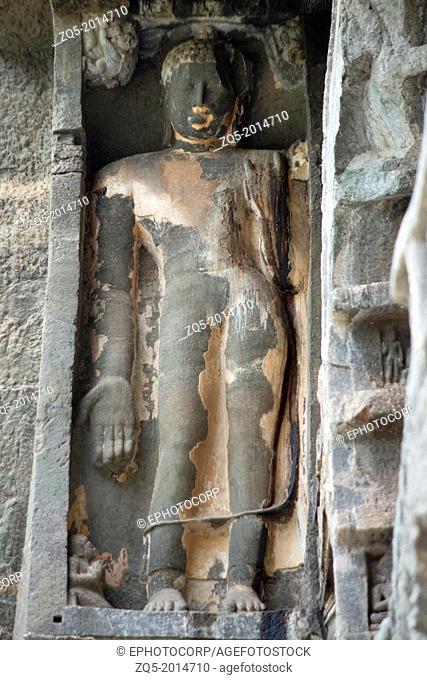 Cave No 26 : Buddha image in Varada mudra on the left of the arch of Chaitya, the remains of the plaster suggest that it was painted. circa 5th