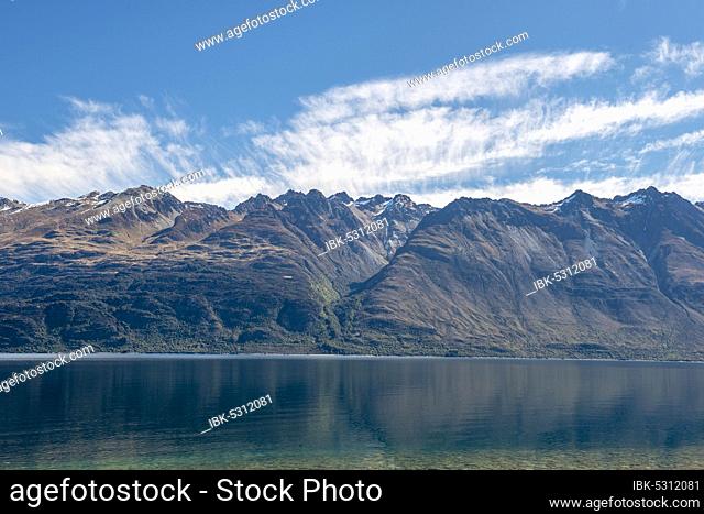 Mountains mirror the lake, Lake Wakatipu, Otago, South Island, New Zealand, Oceania
