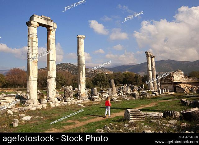 Visitor near the columns in the Temple Of Aphrodite, Aphrodisias, Geyre, Aydin Province, Asia Minor, Turkey, Europe
