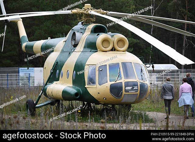 14 September 2021, Mecklenburg-Western Pomerania, Prora: The Mi-8 TB military helicopter in camouflage paint is the latest exhibit at the NVA Museum Prora on...