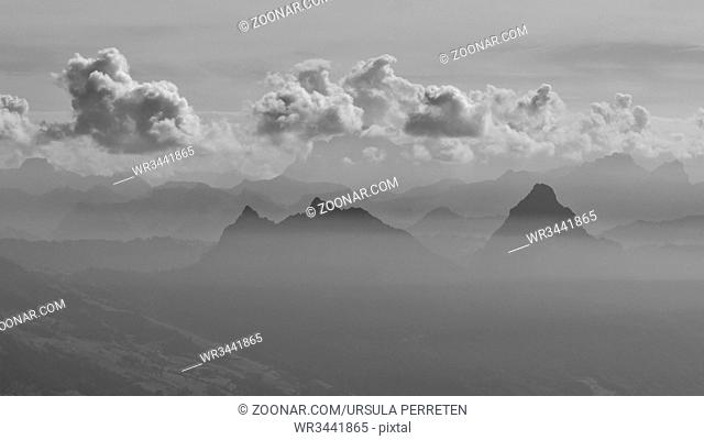 Peaks of Mount Kleiner Mythen and Mount Grosser Mythen reaching out of a sea of fog