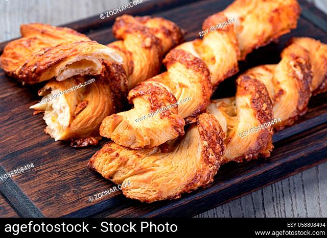Cheese filled roll on a wooden