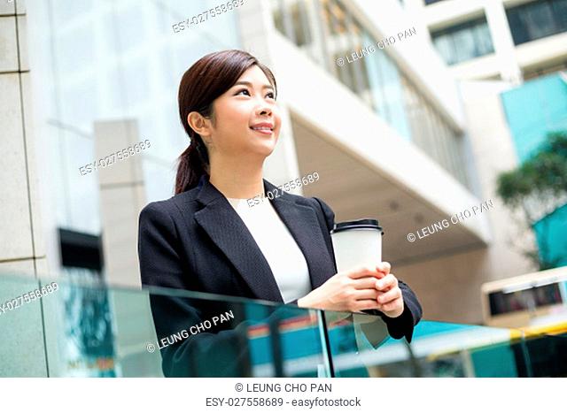 Young Businesswoman holding a coffee cup