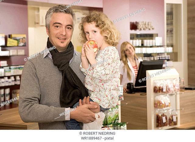 Father and Daughter in Pharmacy, Munich, Bavaria, Germany