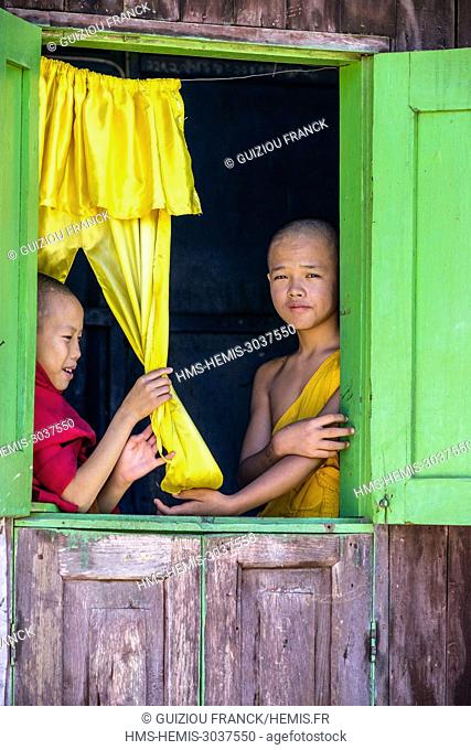Myanmar (Burma), Shan state, Hsipaw, young monks looking out the window of a monastery