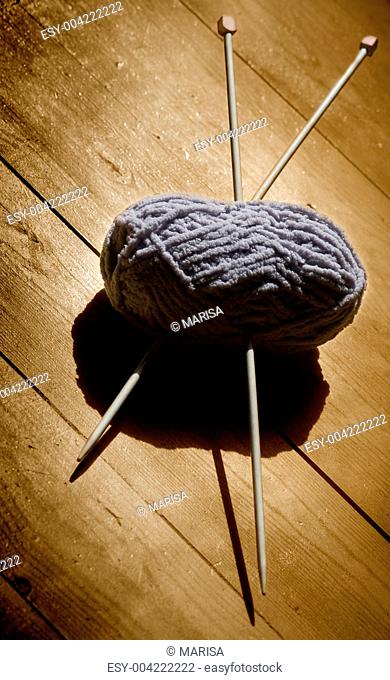 skein of wool and knitting needles