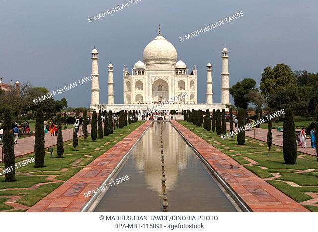 Reflection of Taj Mahal in pond Seventh Wonders of World on the south bank of Yamuna river , Agra , Uttar Pradesh , India UNESCO World Heritage Site