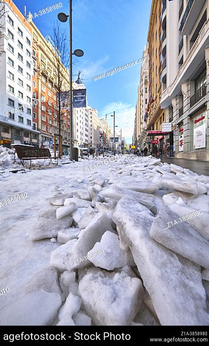 Gran Via Street covered with ice blocks after the Storm Filomena snowfall. Madrid. Spain