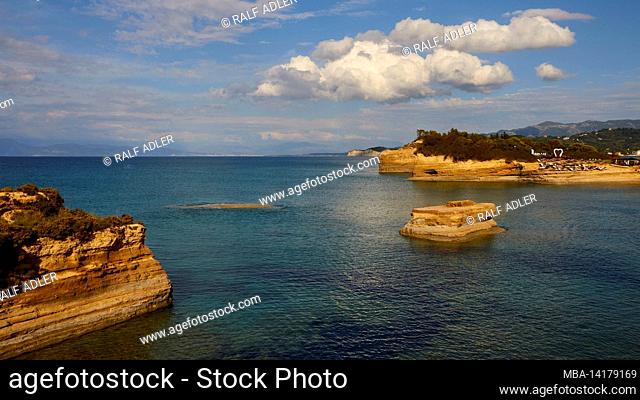 Greece, Greek Islands, Ionian Islands, Corfu, north coast, bizarre rock formations on the coast, Canal d'amour, blue sky, white clouds, turquoise sea