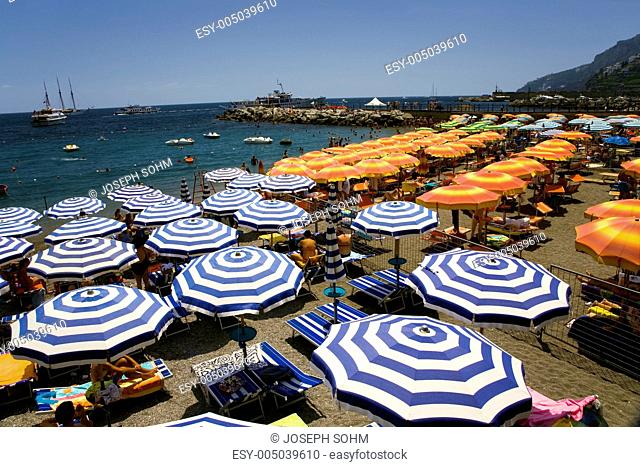 Elevated view of famous rows of beach chairs and umbrellas on Positano Beach, on Italys Amalfi Coast