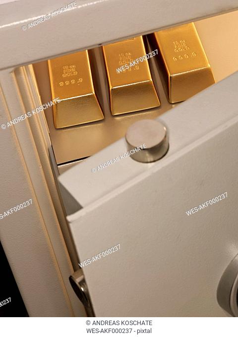 Three pieces of gold bullion in locker, close up