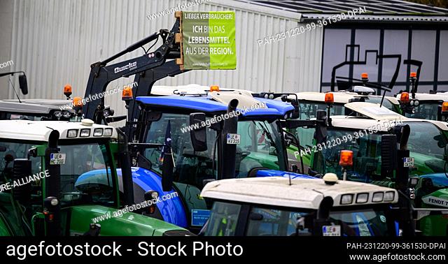 20 December 2023, Lower Saxony, Uelzen: Tractors stand together after a protest action. The reason for this is the German government's plans to abolish the...