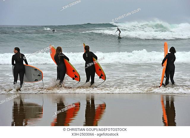 surf class on Zurriola beach, district of Gros, San Sebastian, Bay of Biscay, province of Gipuzkoa, Basque Country, Spain, Europe